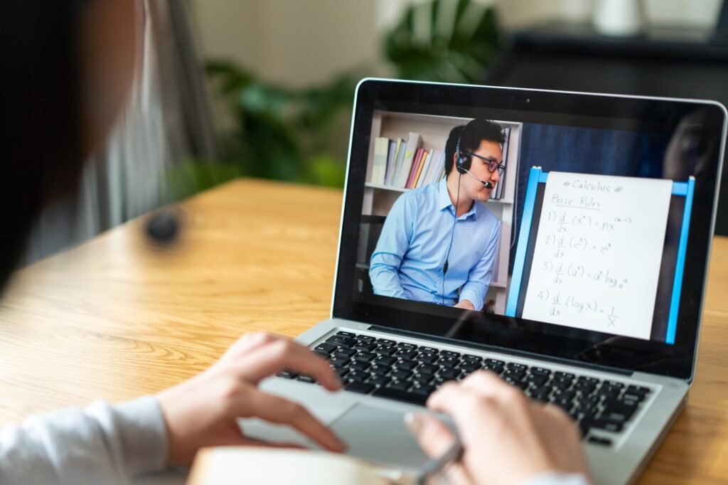 Homeschool Caucasian cute young girl student learning virtual internet online class.